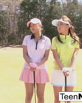 Cute Asian teen girls play a game of strip golf